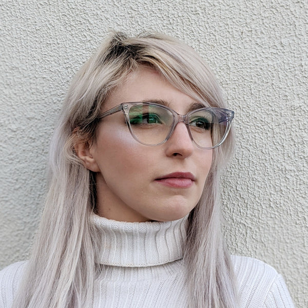 woman modelling the 16307 clear transparent cat eye glasses frame. Affordable 1950s Style cat eye frame with quality acetate material. Suitable as optical glasses or sunglasses, prescription or non-prescription options.
